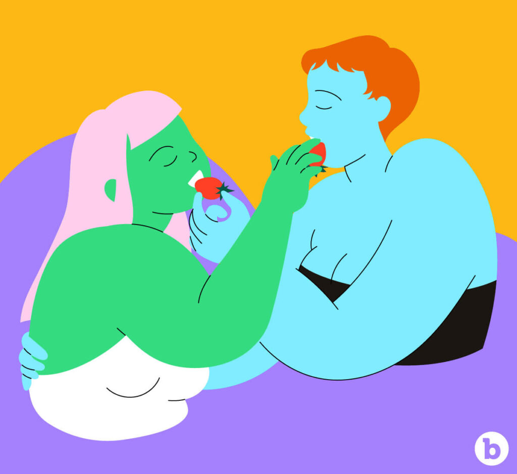 Lesbian couple feeding each other during sex